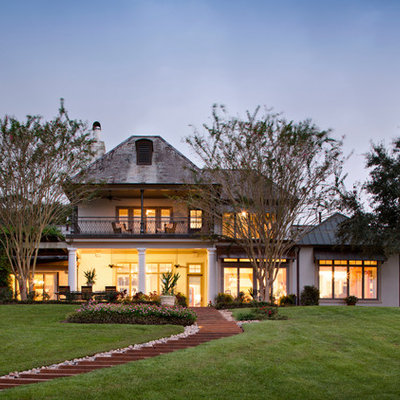 Inspiration for a huge traditional backyard landscaping in New Orleans.