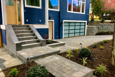 Photo of a traditional front yard concrete paver driveway in Seattle.
