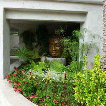 Magical Water Feature Enveloped By Lush Tropical Plantings