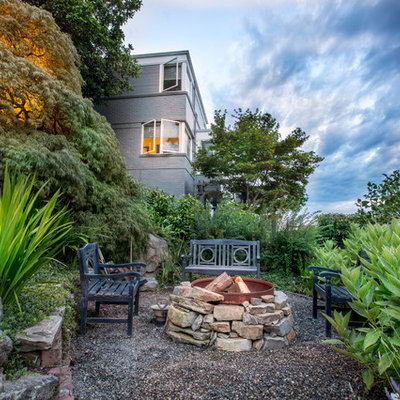 Design ideas for a large traditional full sun hillside gravel formal garden in Seattle with a fire pit for summer.