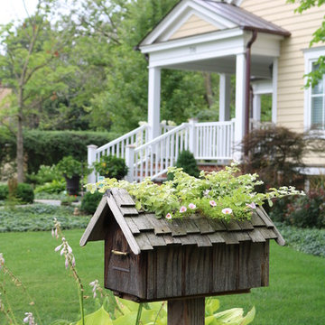 Mailbox with Shake Roof Planted with Pink Flowers