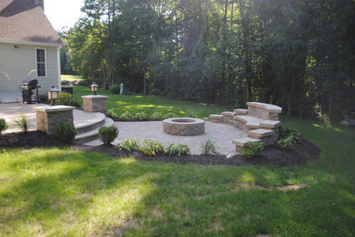 This is an example of a traditional backyard concrete paver landscaping in Bridgeport.