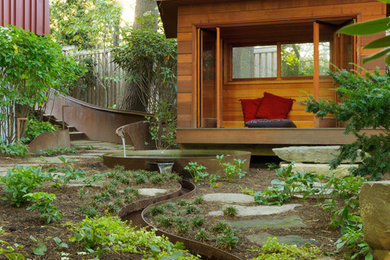 This is an example of a contemporary full sun backyard stone water fountain landscape in Boston.