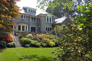 Inspiration for a large traditional back formal partial sun garden in Boston with a garden path and mulch.