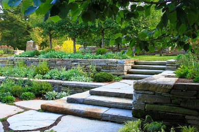Design ideas for a backyard stone landscaping in Burlington.