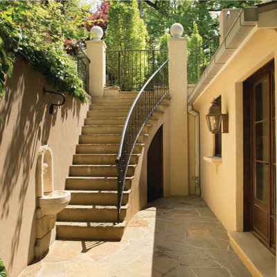 Inspiration for a mediterranean courtyard stone landscaping in DC Metro.