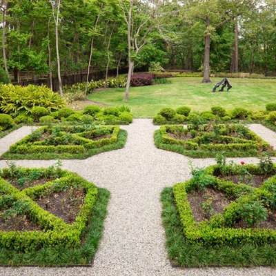 Photo of a huge mediterranean backyard gravel formal garden in Houston.