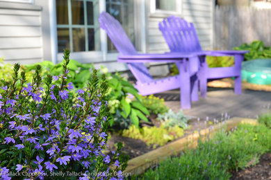 This is an example of a small transitional backyard landscaping in Portland Maine for spring.