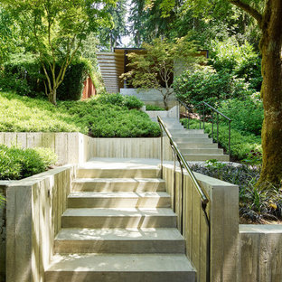 Design ideas for a contemporary front yard concrete paver retaining wall landscape in Seattle.