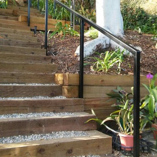 Photo of a mid-sized contemporary drought-tolerant and partial sun backyard gravel garden path in Los Angeles.