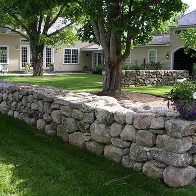 Photo of a large farmhouse partial sun courtyard stone garden path in Boston for summer.