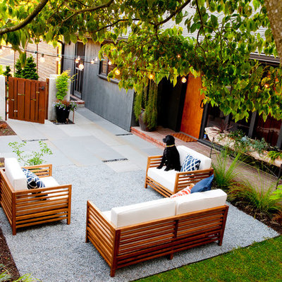 Inspiration for a small mid-century modern partial sun front yard stone garden path in Seattle.