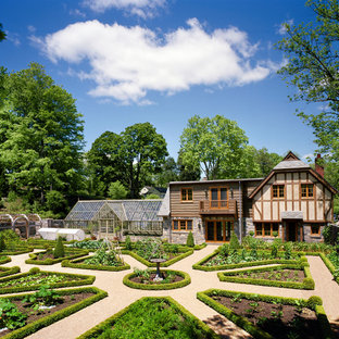 Inspiration for a french country full sun backyard gravel vegetable garden landscape in New York.