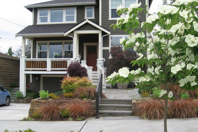 Photo of a large craftsman full sun backyard stone landscaping in Seattle.