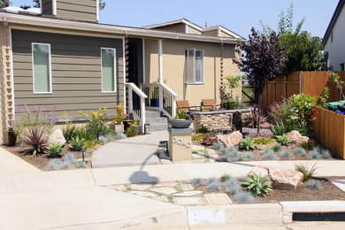 This is an example of a traditional drought-tolerant and full sun front yard concrete paver landscaping in San Diego.