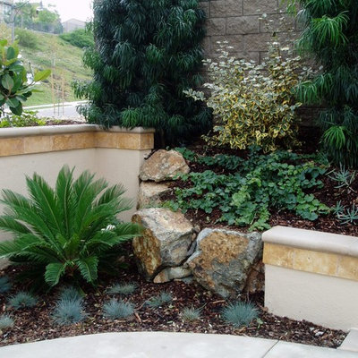 Photo of a mediterranean hillside stone landscaping in San Diego.