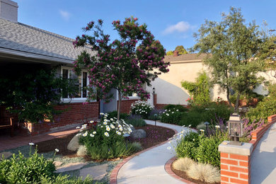This is an example of a mid-sized mediterranean drought-tolerant and full sun front yard garden path in San Diego.