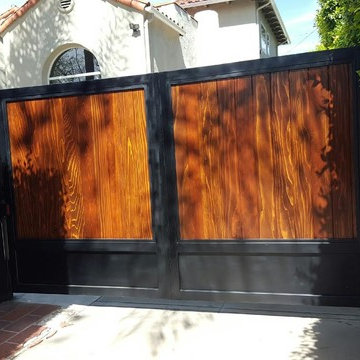 Motorized Iron Framed Gate with Wood Paneling