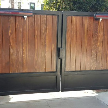 Motorized Iron Framed Gate with Wood Paneling