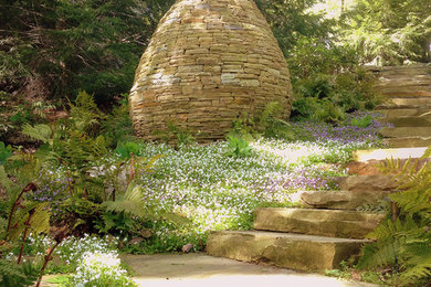 Inspiration for a large traditional shade hillside stone garden path in Other.