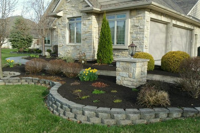 Inspiration for a mid-sized traditional full sun front yard brick driveway in Other for summer.