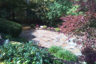 Inspiration for a transitional backyard stone landscaping in Cincinnati.