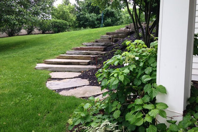 Design ideas for a small contemporary backyard stone landscaping in New York.