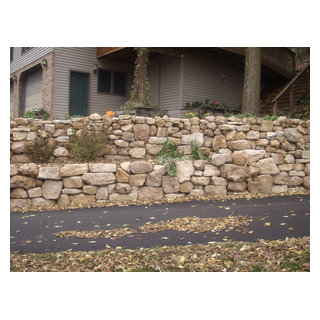 Natural Limestone boulder retaining wall with built in stairway