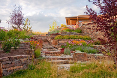Inspiration for a small southwestern full sun backyard stone formal garden in Boise with a fire pit for spring.