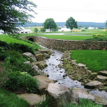 Natural stone walls and stream boulder embankment
