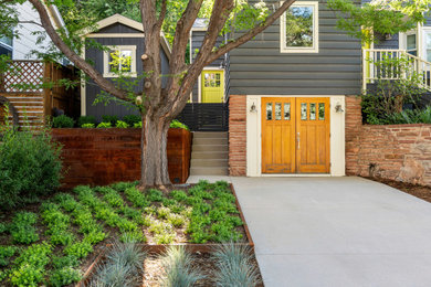 Photo of a small craftsman partial sun front yard concrete paver landscaping in Denver.
