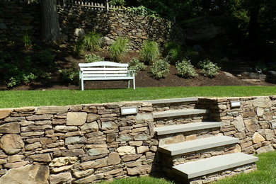 Design ideas for a large traditional partial sun backyard concrete paver formal garden in Boston.