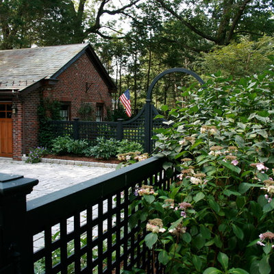 Design ideas for a large traditional partial sun front yard stone landscaping in Boston.