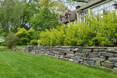 Photo of a large french country full sun side yard landscaping in Philadelphia for summer.