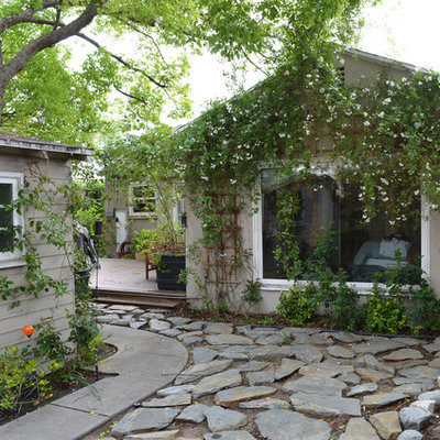 Inspiration for a traditional backyard stone landscaping in Los Angeles.