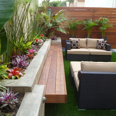 Inspiration for a small contemporary shade backyard water fountain landscape in Los Angeles.