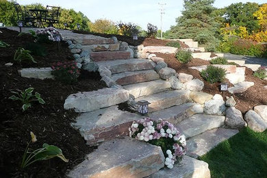 Inspiration for a mid-sized transitional partial sun backyard stone garden path in Milwaukee.