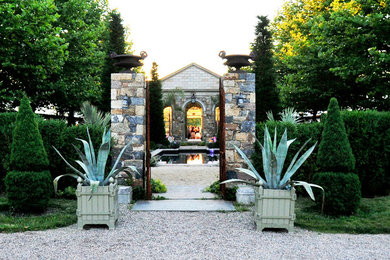 Photo of a mid-sized farmhouse courtyard concrete paver formal garden in New York.