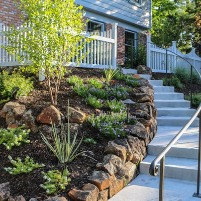 Photo of a mid-sized traditional front yard concrete paver retaining wall landscape in San Francisco.