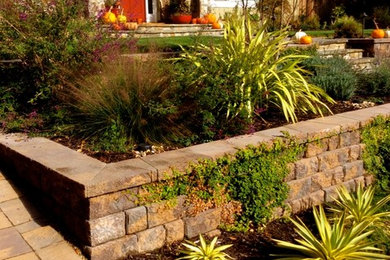 Inspiration for a mid-sized partial sun front yard concrete paver retaining wall landscape in San Francisco for fall.