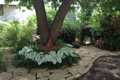 Photo of a mid-sized partial sun backyard stone garden path in Dallas for summer.