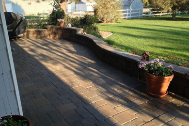 Design ideas for a large formal full sun garden in Boise with natural stone paving.