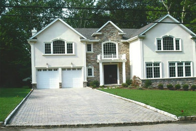 Photo of a mid-sized traditional partial sun front yard brick driveway in New York.