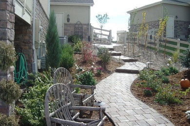 Design ideas for a large partial sun backyard brick garden path in Denver.