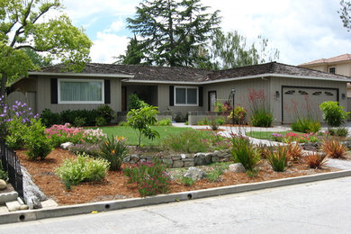 This is an example of a mid-sized transitional front yard stone driveway in San Francisco.