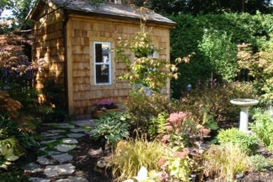 Inspiration for a large shabby-chic style full sun stone landscaping in Toronto for summer.