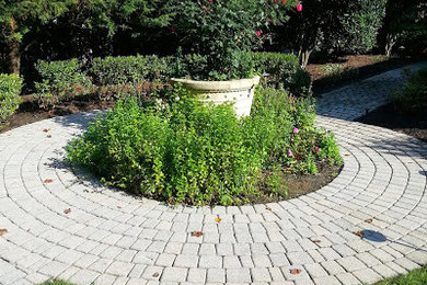 Design ideas for a mid-sized partial sun courtyard brick landscaping in DC Metro.