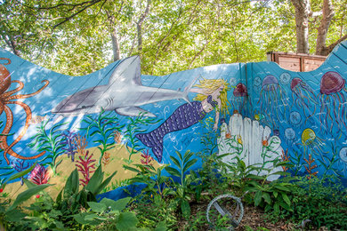 Inspiration for a large contemporary partial sun backyard mulch formal garden in Austin.