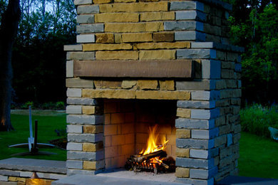 This is an example of a back patio in Minneapolis with natural stone paving.