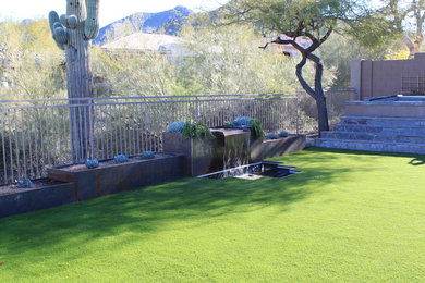 Photo of an industrial backyard water fountain landscape in Phoenix.
